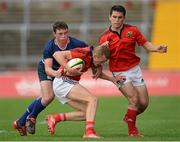 12 September 2012; Munster's Stephen Fitzgerald with support from team-mate Steve McMahon, right, is tackled by Fergal Cleary, Leinster. Under 18 Schools Interprovincial, Munster v Leinster, Thomond Park, Limerick. Picture credit: Stephen McCarthy / SPORTSFILE