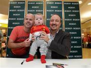 13 September 2012; Former Liverpool FC manager Rafa Benitez with Paul Moore and his son Emlyn, age 4 months, from Finglas, Dublin, during a signing session for his new book, Champions League Dreams, which is available from Eason stores nationwide and from easons.com. Rafa Benitez Book Signing, Easons, O'Connell Street, Dublin. Picture credit: Brian Lawless / SPORTSFILE