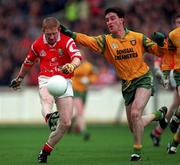 5 April 1998; Aidan Dorgan of Cork in action against Barry McGowan of Donegal during the Church & General National Football League Quarter-Final match between Cork and Donegal at Croke Park in Dublin. Photo by Ray McManus/Sportsfile
