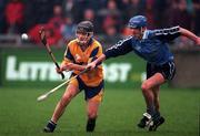 29 March 1998; Alan Markham of Clare in action against John Finnegan of Dublin during the Church & General National Hurling League match between Dublin and Clare in Parnell Park in Dublin. Photo by Ray McManus/Sportsfile