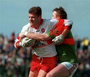 5 April 1998; Anthony Tohill of Derry in action against Pat Fallon of Mayo during the Church & General National Football League quarter-final match between Derry and Mayo at Pairc Markievicz in Sligo. Photo by Damien Eagers/Sportsfile