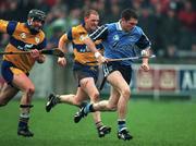 29 March 1998; Barry O'Sullivan of Dublin in action against Sean McMahon, left, and Christy Chaplin of Clare during the Church & General National Hurling League match between Dublin and Clare at Parnell Park in Dublin. Photo by Ray McManus/Sportsfile