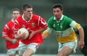 1 November 1998; Brendan O'Sullivan of Cork in action against Sean Grennan of Offaly during the Church & General National Football League match between Offaly and Cork at O'Connor Park in Tullamore, Offaly. Photo by David Maher/Sportsfile