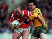 5 April 1998; Brian Corcoran of Cork in action against John Duffy of Donegal during the Church & General National Football League quarter-final match between Cork and Donegal at Croke Park in Dublin. Photo by Ray McManus/Sportsfile