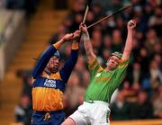 17 March 1996; Niall Gillgan of Sixmilebridge in action against Brian Og Cunning of Dunloy during the All-Ireland Senior Club Hurling Championship Final match between Sixmilebridge and Dunloy at Croke Park in Dublin. Photo by Ray McManus/Sportsfile