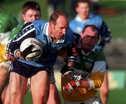 29 November 1998; Brian Stynes of Dublin is tackled by Barry Malone of Offaly during the Church & General National Football League Division 1a match between Offaly and Dublin at O'Connor Park in Tullamore, Offaly. Photo by Matt Browne/Sportsfile