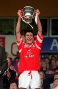 12 July 1998; Cork captain Cathal McCarthy lifts the cup following the Munster Minor Hurling Final match between Clare and Cork at Semple Stadium in Thurles, Tipperary. Photo by Brendan Moran/Sportsfile
