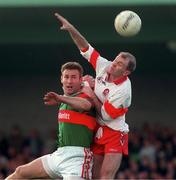 5 April 1998; Johnny McGurk of Derry in action against Colm McManamon of Mayo during the Church & General National Football League quarter-final match between Derry and Mayo at Pairc Markievicz in Sligo. Photo by David Maher/Sportsfile