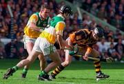 13 September 1998; DJ Carey of Kilkenny in action against Hubert Rigney and Kevin Martin of Offaly during the Guinness All-Ireland Senior Hurling Championship Final between Offaly and Kilkenny at Croke Park in Dublin. Photo by David Maher/Sportsfile