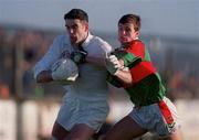 29 November 1998; Dermot Earley of Kildare holds off the challenge of Aidan Higgins of Mayo during the Church & General National Football League match between Kildare and Mayo at St Conleth's Park in Newbridge, Kildare. Photo by Brendan Moran/Sportsfile