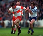 12 April 1998; Eamonn Burns of Derry is tackled by Dermot McArdle of Monaghan during the Church & General National Football League semi-final match between Derry and Monaghan at Croke Park in Dublin. Photo by Ray McManus/Sportsfile