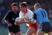 1 November 1998: Eoin Gormley of Tyrone in action against Declan Darcy of Dublin during the Church & General National League Football match between Dublin and Tyrone at Parnell Park in Dublin. Photo by Ray McManus/Sportsfile