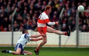 12 April 1998; Gary Magill of Derry shoots at goal despite the efforts of Damien Freeman of Monaghan during the Church & General National Football League semi-final match between Derry and Monaghan at Croke Park in Dublin. Photo by Ray McManus/Sportsfile