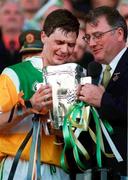 13 September 1998; Offaly captain Hubert Rigney receives the Liam MacCarthy Cup from GAA President Joe McDonagh following the Guinness All-Ireland Senior Hurling Championship Final between Offaly and Kilkenny at Croke Park in Dublin. Photo by David Maher/Sportsfile