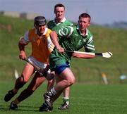 14 June 1998; Jimmy Moloney of London in action against John Carson of Antrim during the Guinness Ulster Senior Hurling Championship semi-final match between Antrim and London at Casement Park in Belfast. Photo by Damien Eagers/Sportsfile