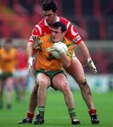 5 April 1998; John Joe Doherty of Donegal in action against Pat Hegarty of Cork during the Church & General National Football League Quarter-Final match between Cork and Donegal at Croke Park in Dublin. Photo by Ray McManus/Sportsfile