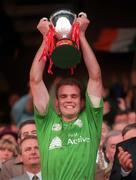 18 October 1998; Ireland captain John McDermott lifts the Coca-Cola International Rules Series Trophy after the International Rules match between Ireland and Australia at Croke Park in Dublin. Photo by Damien Eagers/Sportsfile
