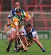 8 June 1997; John Taylor of Laois in action against Joe Errity of Offaly during the Guinness Leinster Senior Hurling Championship quarter-final match between Offaly and Laois at Croke Park in Dublin. Photo by David Maher/Sportsfile