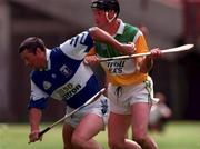 8 June 1997; John Taylor of Laois in action against Billy Dooley of Offaly during the Guinness Leinster Senior Hurling Championship quarter-final match between Offaly and Laois at Croke Park in Dublin. Photo by David Maher/Sportsfile