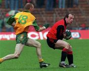 26 May 1996; John Treanor of Down in action against Martin Shovlin of Donegal during the Ulster Senior Football Championship Preliminary Round at St. Tiernach's Park in Clones, Monaghan. Photo by David Maher/Sportsfile