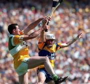 9 August 1998; Kevin Kinahan of Offaly in action against Ger O'Loughlin of Clare during the Guinness All-Ireland Senior Hurling Championship semi-final match between Offaly and Clare at Croke Park in Dublin. Photo by David Maher/Sportsfile