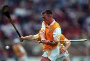 26 July 1998; Kieran Kelly of Antrim in action against Colm Cassidy of Offaly during the Guinness All-Ireland Senior Hurling Championship Quarter-Final match between Offaly and Antrim at Croke Park in Dublin.Photo by Ray McManus/Sportsfile