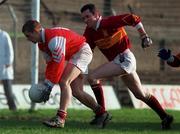 22 November 1998; Michael Kane of Fr. Manning Gaels in action against J.J. Eyres of Éire Óg during the AIB Leinster Senior Club Football Championship semi-final match between Fr Manning Gaels and Éire Óg at O'Connor Park in Tullamore, Offaly. Photo by David Maher/Sportsfile