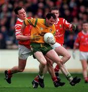 5 April 1998; Noel Hegarty of Donegal in action against Michael Monaghan of Cork during the Church & General National Football League quarter-final match between Cork and Donegal at Croke Park in Dublin. Photo by Ray McManus/Sportsfile