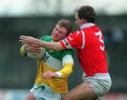 1 November 1998; Frank Weir of Offaly in action against Ronan McCarthy of Cork during the Church & General National Football League match between Offaly and Cork at O'Connor Park in Tullamore, Offaly. Photo by David Maher/Sportsfile
