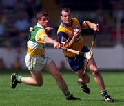 9 August 1998; Ollie Baker of Clare is tackled by Michael Duignan of Offaly during the Guinness All-Ireland Senior Hurling Championship semi-final match between Offaly and Clare at Croke Park in Dublin. Photo by Brendan Moran/Sportsfile