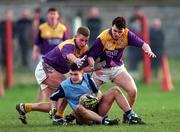22 February 1997; Paul Croft of Dublin is tackled by Rory Stafford and Jason Lawlor of Wexford during the Leinster Under-21 Football Championship match at Parnell Park in Dublin. Photo by Ray McManus/Sportsfile
