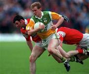 9 June 1996; Ronan Mooney of Offaly gets through the Louth defence during the Bank of Ireland Leinster Senior Football Championship Quarter-Final between Louth and Offaly at Pairc Tailteann in Navan. Photo by Pat Cashman/Sportsfile