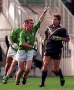 18 October 1998; Ireland's Sean og De Paor celebrates scoring his side's first goal, as Australia's Shane Crawford looks on, during the International Rules match between Ireland and Australia at Croke Park in Dublin. Photo by Brendan Moran/Sportsfile