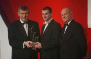 29 November 2002; Aidan O'Rourke, Armagh, is presented with his All-Star award by GAA President Sean McCague and Paul Donovan, Chief Executive, Vodafone, at the VODAFONE GAA All-Star Awards in the Citywest Hotel, Dublin. Football. Hurling. Picture credit; Ray McManus / SPORTSFILE *EDI*