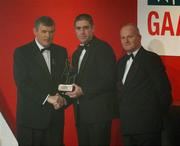29 November 2002; Darragh O'Se, Kerry, is presented with his All-Star award by GAA President Sean McCague and Paul Donovan, Chief Executive, Vodafone, at the VODAFONE GAA All-Star Awards in the Citywest Hotel, Dublin. Football. Hurling. Picture credit; Ray McManus / SPORTSFILE *EDI*