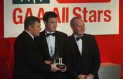 29 November 2002; Ronan Clarke, Armagh, is presented with his Young Player of the year award by GAA President Sean McCague and Paul Donovan, Chief Executive, Vodafone, at the VODAFONE GAA All-Star Awards in the Citywest Hotel, Dublin. Football. Hurling. Picture credit; Ray McManus / SPORTSFILE *EDI*