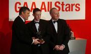 29 November 2002; Colm Cooper, Kerry, is presented with his All-Star award by GAA President Sean McCague and Paul Donovan, Chief Executive, Vodafone, at the VODAFONE GAA All-Star Awards in the Citywest Hotel, Dublin. Football. Hurling. Picture credit; Ray McManus / SPORTSFILE *EDI*