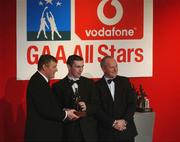 29 November 2002; Steven McDonnell, Armagh, is presented with his All-Star award by GAA President Sean McCague and Paul Donovan, Chief Executive, Vodafone, at the VODAFONE GAA All-Star Awards in the Citywest Hotel, Dublin. Football. Hurling. Picture credit; Ray McManus / SPORTSFILE *EDI*