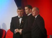 29 November 2002; Paul McGrane, Armagh, is presented with his All-Star award by GAA President Sean McCague and Paul Donovan, Chief Executive, Vodafone, at the VODAFONE GAA All-Star Awards in the Citywest Hotel, Dublin. Football. Hurling. Picture credit; Ray McManus / SPORTSFILE *EDI*