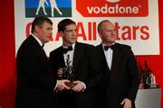 29 November 2002; Kieran McGeeney, Armagh, is presented with his All-Star award by GAA President Sean McCague and Paul Donovan, Chief Executive, Vodafone, at the VODAFONE GAA All-Star Awards in the Citywest Hotel, Dublin. Football. Hurling. Picture credit; Ray McManus / SPORTSFILE *EDI*