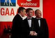 29 November 2002; Anthony Lynch, Cork, is presented with his All-Star award by GAA President Sean McCague and Paul Donovan, Chief Executive, Vodafone, at the VODAFONE GAA All-Star Awards in the Citywest Hotel, Dublin. Football. Hurling. Picture credit; Ray McManus / SPORTSFILE *EDI*