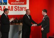 29 November 2002; Stephen Cluxton, Dublin, is presented with his All-Star award by GAA President Sean McCague and Paul Donovan, Chief Executive, Vodafone, at the VODAFONE GAA All-Star Awards in the Citywest Hotel, Dublin. Football. Hurling. Picture credit; Ray McManus / SPORTSFILE *EDI*