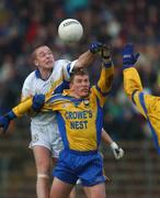 1 December 2002; Peter Loughran, Errigal Ciaran, contests a high ball with Paul Brewster, Enniskillen. Errigal Ciaran v Enniskillen, Ulster Club Football Final, St. Tighearnachs Park, Clones, Co. Monaghan. Football. Picture credit; Damien Eagers / SPORTSFILE *EDI*