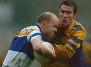 1 December 2002; Peter Canavan, Errigal Ciaran, is tackled by Michael Lilly, Enniskillen. Errigal Ciaran v Enniskillen, Ulster Club Football Final, St. Tighearnachs Park, Clones, Co. Monaghan. Picture credit; Damien Eagers / SPORTSFILE *EDI*