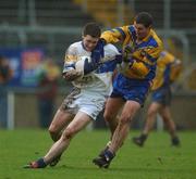 1 December 2002; Enda McGinley, Errigal Ciaran, is challenged by Neil Cox, Enniskillen. Errigal Ciaran v Enniskillen, Ulster Club Football Final, St. Tighearnachs Park, Clones, Co. Monaghan. Picture credit; Damien Eagers / SPORTSFILE *EDI*