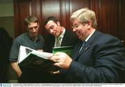 2 December 2002; Dublin footballer Ray Cosgrove, Armagh captain Kieran McGeeney, left, and SPORTSFILE photographer Ray McManus, right, pictured at the launch of 'A Season of Sundays 2002', a collection of Images of the 2002 Gaelic Games year by the SPORTSFILE photographers, in the Westin Hotel, Dublin. Picture credit; David Maher / SPORTSFILE