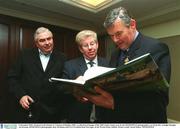2 December 2002; Pictured at the launch of 'A Season of Sundays 2002', a collection of Images of the 2002 Gaelic Games year by the SPORTSFILE photographers, are from left, Armagh Manager Joe Kernan, SPORTSFILE photographer Ray McManus and GAA President Sean McCague, in the Westin Hotel, Dublin. Picture credit; David Maher / SPORTSFILE
