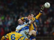 1 December 2002; Peter Loughran and Pascal Canavan, Errigal Ciaran, contest a high ball with Paul Brewster, Enniskillen. Errigal Ciaran v Enniskillen, Ulster Club Football Final, St Tighearnachs Park, Clones, Co. Monaghan. Picture credit; Damien Eagers / SPORTSFILE *EDI*