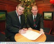 17 December 2002; Amid Christmas celebrations at the Bank of Ireland Arts Centre, Colege Green, the GAA and Bank of Ireland announced the renewal of the bank's sponsorship of the Bank of Ireland Football Championship for another four years up to and including '007. Pictured at the announcement are, from left, Sean McCague, President of the GAA, Des Crowley, Chief Executive, Retail Financial Services, Bank of Ireland. Football. Picture credit; Brendan Moran / SPORTSFILE