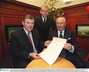 17 December 2002; Amid Christmas celebrations at the Bank of Ireland Arts Centre, Colege Green, the GAA and Bank of Ireland announced the renewal of the bank's sponsorship of the Bank of Ireland Football Championship for another four years up to and including '007. Pictured at the announcement are, from left, Sean McCague, President of the GAA, Des Crowley, Chief Executive, Retail Financial Services, Bank of Ireland and Mike Soden, Group Chief Executive, Bank of Ireland. Football. Picture credit; Brendan Moran / SPORTSFILE